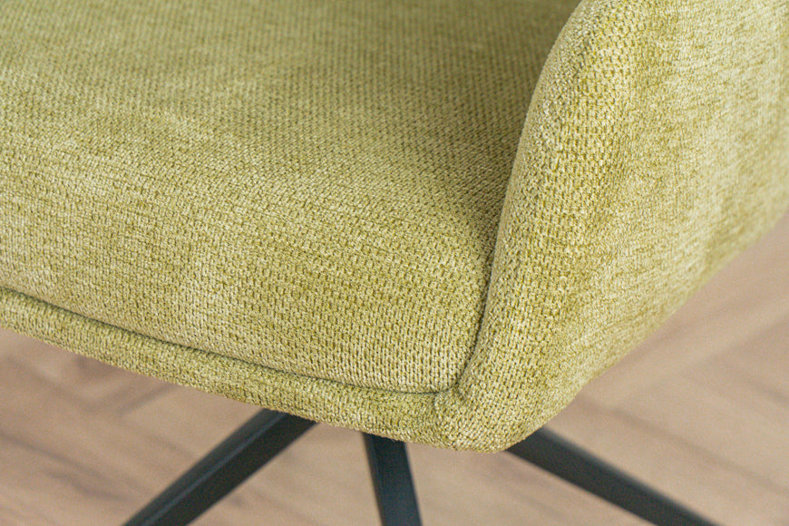 Detail van mosgroene stof van de eetkamerstoel